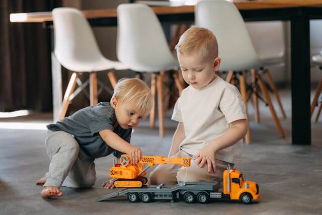 toddler/preschooler boys playing with trucks
