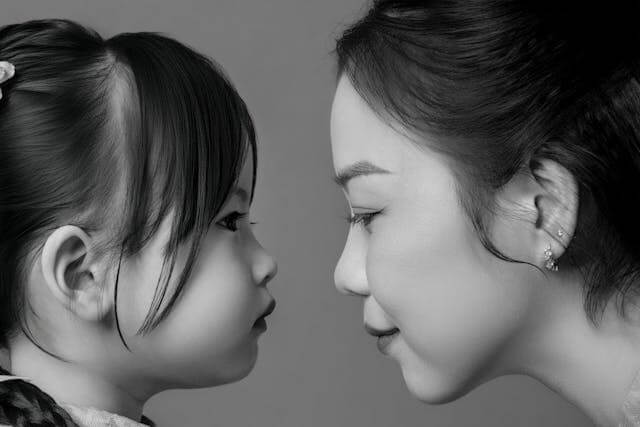 parent looking at her child hiding her grief