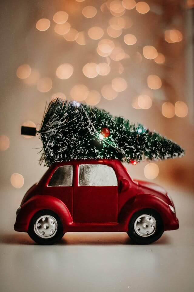 holiday car with christmas tree on top