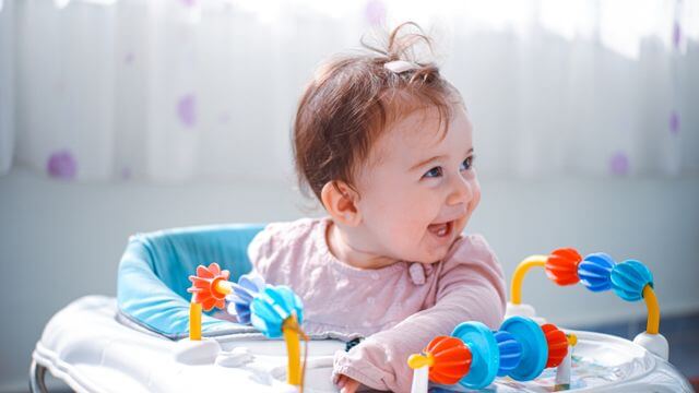 happy baby in walker