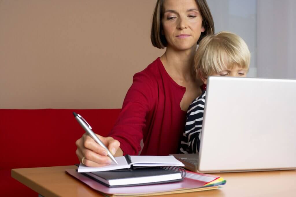 Mom working from home with toddler